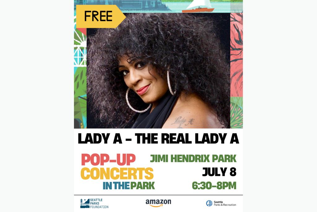 Poster featuring Lady A, smiling with long curly hair, hoop earrings, and a tattoo on her shoulder. Text: "FREE - Lady A – The Real Lady A, Pop-Up Concerts in the Park, Jimi Hendrix Park, July 8, 6:30-8pm." Logos at bottom.