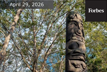 A tall totem pole stands among leafy trees under a blue sky. The date "April 29, 2026" and the Forbes logo appear in the top corners of the image.