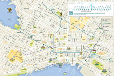 Illustrated downtown Seattle map showing landmarks, parks, attractions, and the Link light rail route from Northgate to Angle Lake, with ferry terminals, waterfront, Pike Place Market, and major neighborhoods labeled.