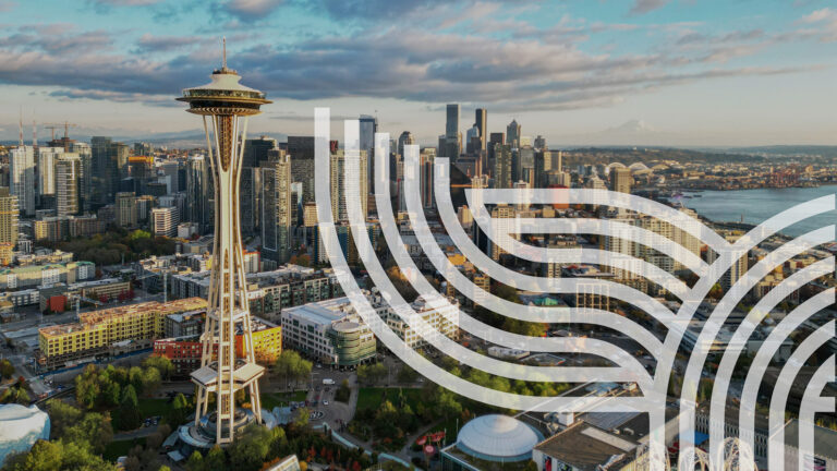 Aerial view of downtown Seattle with the Space Needle in the foreground, modern high-rise buildings, and abstract white line patterns overlaying part of the image.