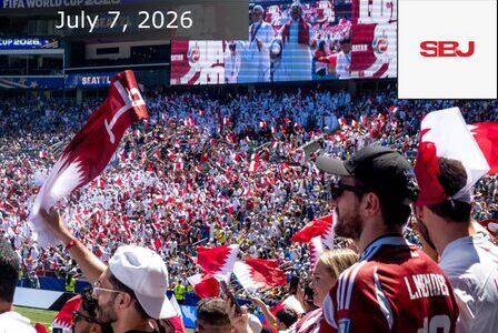 Soccer fans in a stadium wave Qatar flags. The scoreboard shows “FIFA World Cup 2026.” A large screen displays players. Text reads “July 7, 2026” and “SBJ.” The crowd wears red and white.
