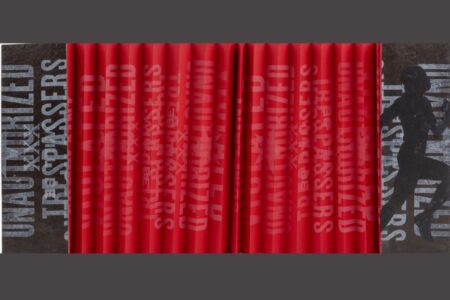 Red curtains with partially visible white text reading “UNAUTHORIZED TRESPASSERS” and a shadowy silhouette of a person on the right side, all set against a dark background.
