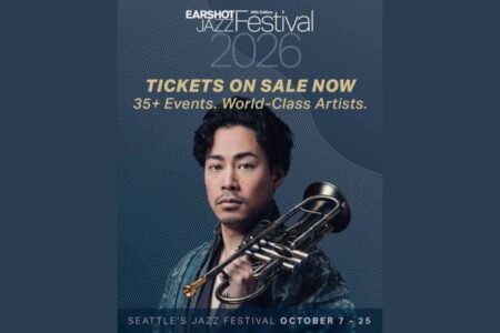 A man holding a trumpet poses against a blue background. Text reads: “Earshot Jazz Festival 2026. Tickets on sale now. 35+ Events. World-Class Artists. Seattle’s Jazz Festival October 7–25.”.