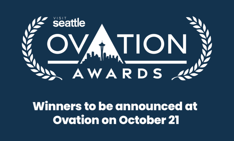 Ovation Awards logo with Seattle skyline silhouette. Text: “Winners to be announced at Ovation on October 21.” Blue background with laurel graphics.